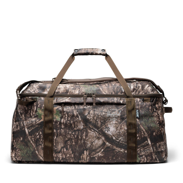 HERSCHEL Realtree All Season 66L Duffle Realtree APX Camo Duffle Bags Herschel Supply Company 